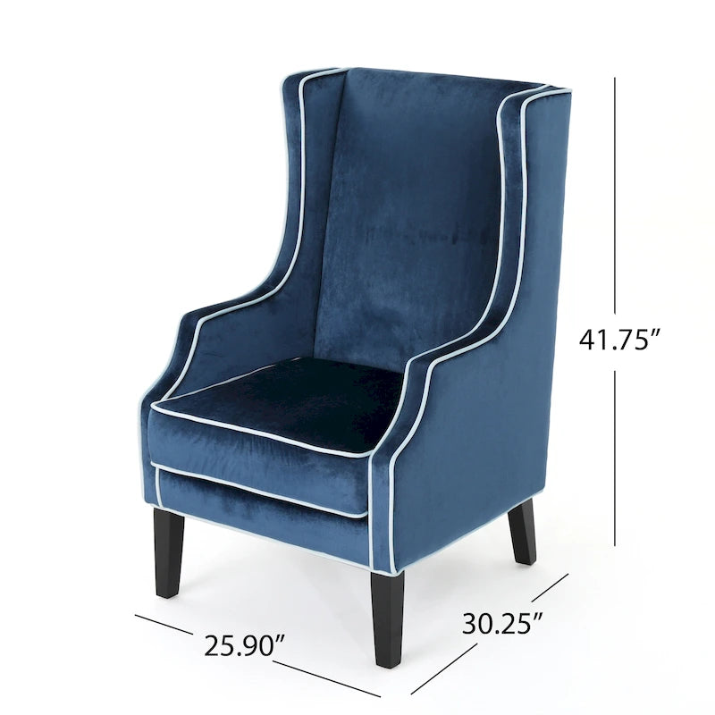 Poltrona decorativa con schienale alto e ali, rivestita in velluto, bordino bianco e gambe in legno nero