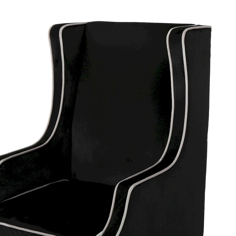 Poltrona decorativa con schienale alto e ali, rivestita in velluto, bordino bianco e gambe in legno nero
