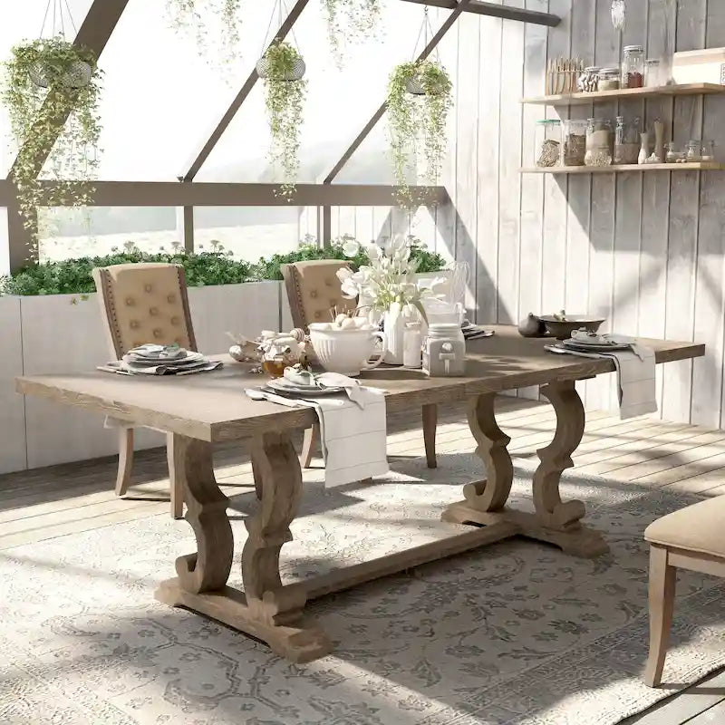 Tavolo da pranzo rustico in legno allungabile con base a cavalletto intagliata, tonalità naturale