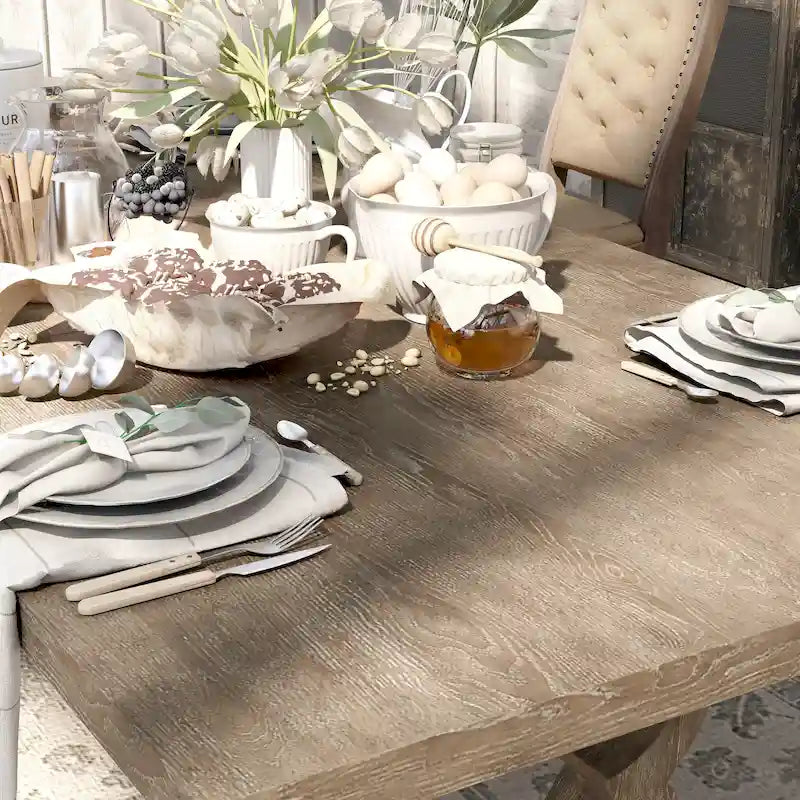 Tavolo da pranzo rustico in legno allungabile con base a cavalletto intagliata, tonalità naturale