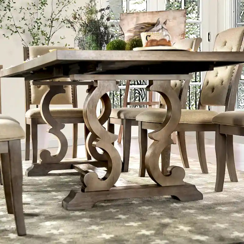 Tavolo da pranzo rustico in legno allungabile con base a cavalletto intagliata, tonalità naturale