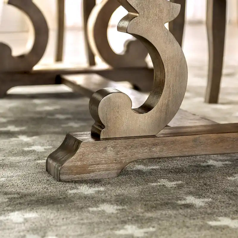 Tavolo da pranzo rustico in legno allungabile con base a cavalletto intagliata, tonalità naturale