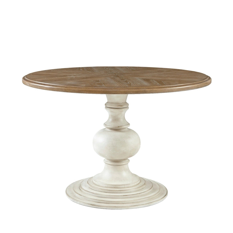 Tavolo da pranzo rotondo con base a piedistallo scultorea, noce di recupero e finitura color crema anticato